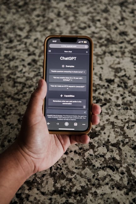 Generative Engine Optimization Services (GEO) By Best Professionals 1 A close-up of a hand holding a smartphone with ChatGPT interface on display.