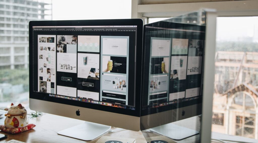pexels-photo-326505-326505 Dual monitors on a desk, showcasing web design in a modern office setting.